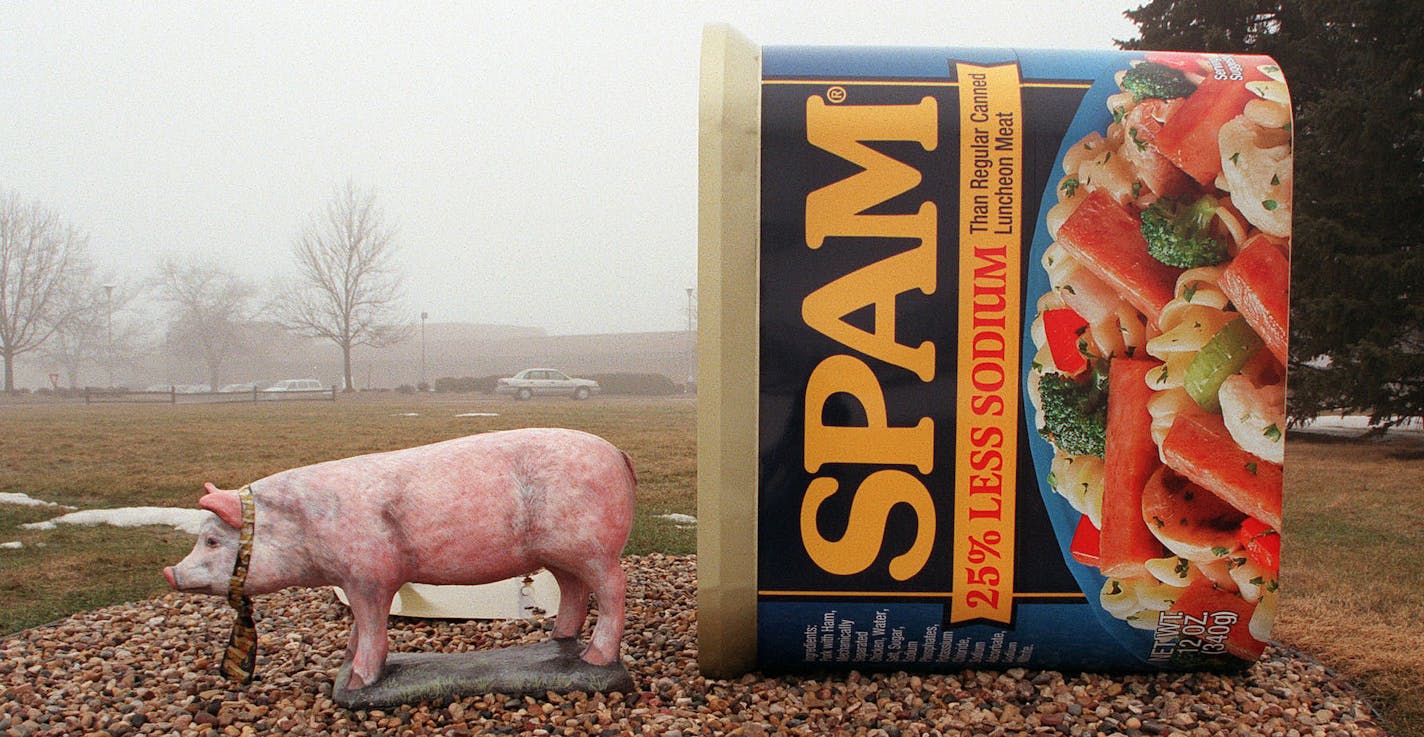 GENERAL INFORMATION: Austin, MN. Thursday 3/29/2001 The Hormel company will open a new museum late summer / fall 2001 dedicated to one of its most recognized products, - Spam. IN THIS PHOTO: 'Spam Town USA" is reflected by the giant Spam can with pig artwork on the lawn of the Hormel company offices. ORG XMIT: MIN2014051615054356