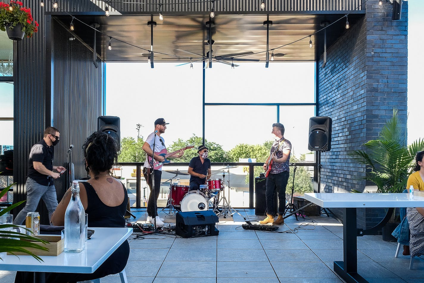 Live music accompanies dinner at Travail's new rooftop cantina.