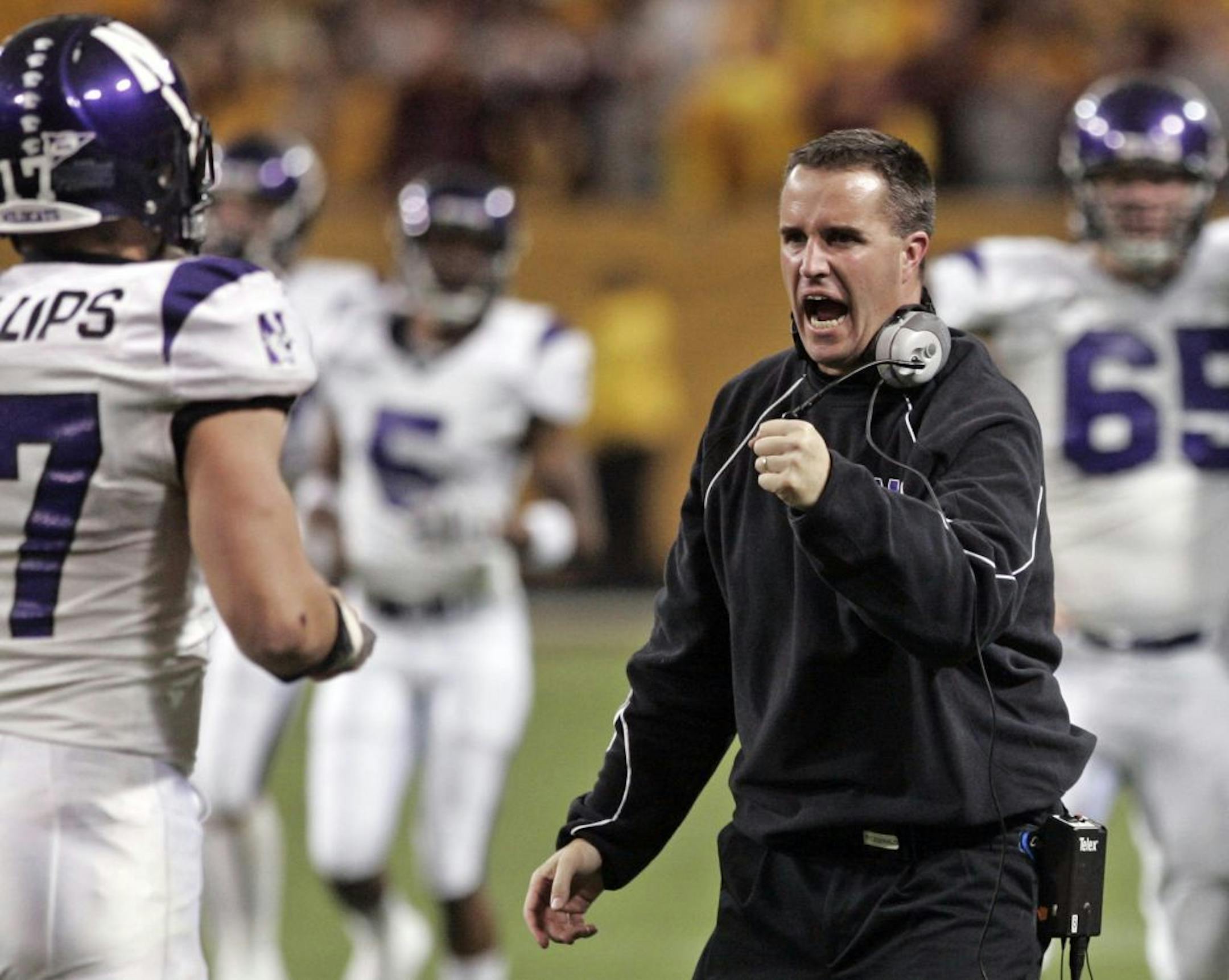 In this Nov. 1, 2008 file photo, Northwestern head coach Pat Fitzgerald celebrates after Minnesota missed a field goal in the third quarter of an NCAA college football game in Minneapolis. Northwestern won 24-17. Fitzgerald's whirlwind year has included election into the College Football Hall of Fame from his days as a hard-hitting linebacker at Northwestern. And now as a young 33-year-old coach in just his third season, he's led his alma mater to a nine-win season and a bowl bid. The Wildcats h