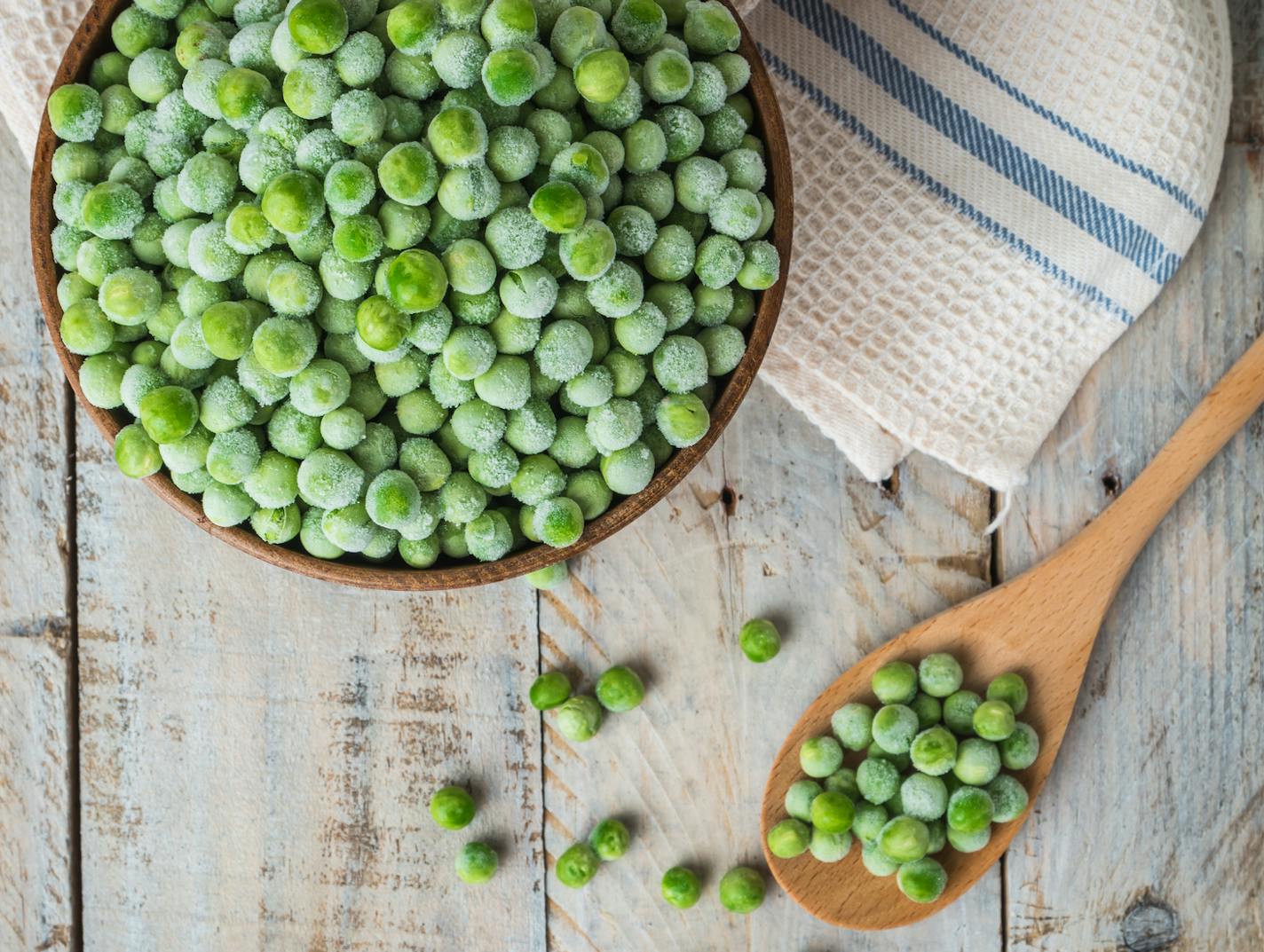 Fresh frozen peas. Vegetable food background healthy vegetarian natural meal.