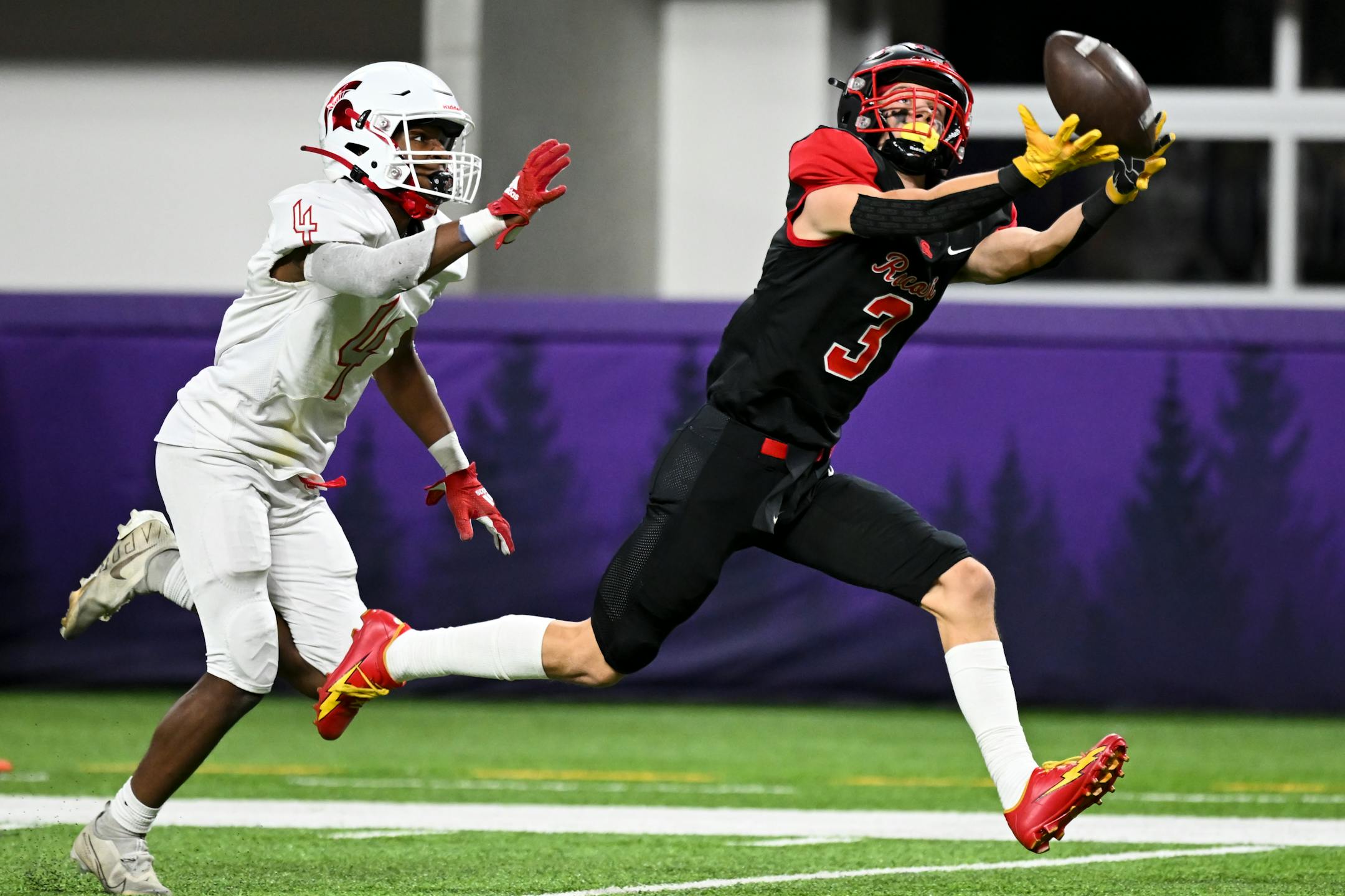 Rocori wide receiver Hunter Nistler (3) misses a potential touchdown catch as he's defended by Simley defensive back Dezmond Smith (4).