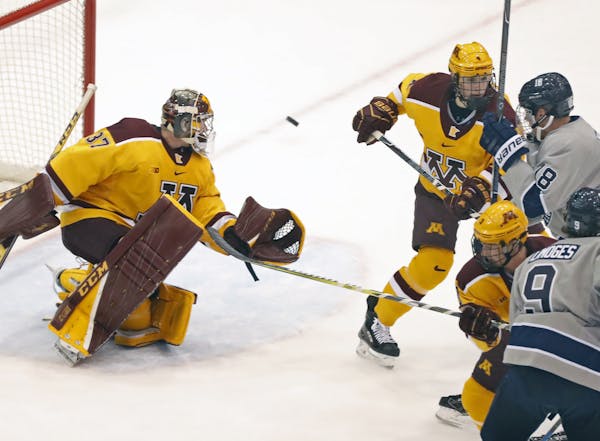 Gophers goalie Eric Schierhorn(37) makes a save.] Sunday afternoon Gophers hockey game, vs. Penn State. at Mariucci 3M Arena.Richard Tsong-Taatarii/Ri