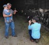 Washington Post reporter Christopher Ingraham takes photos at a dairy farm during a tour of Red Lake County.