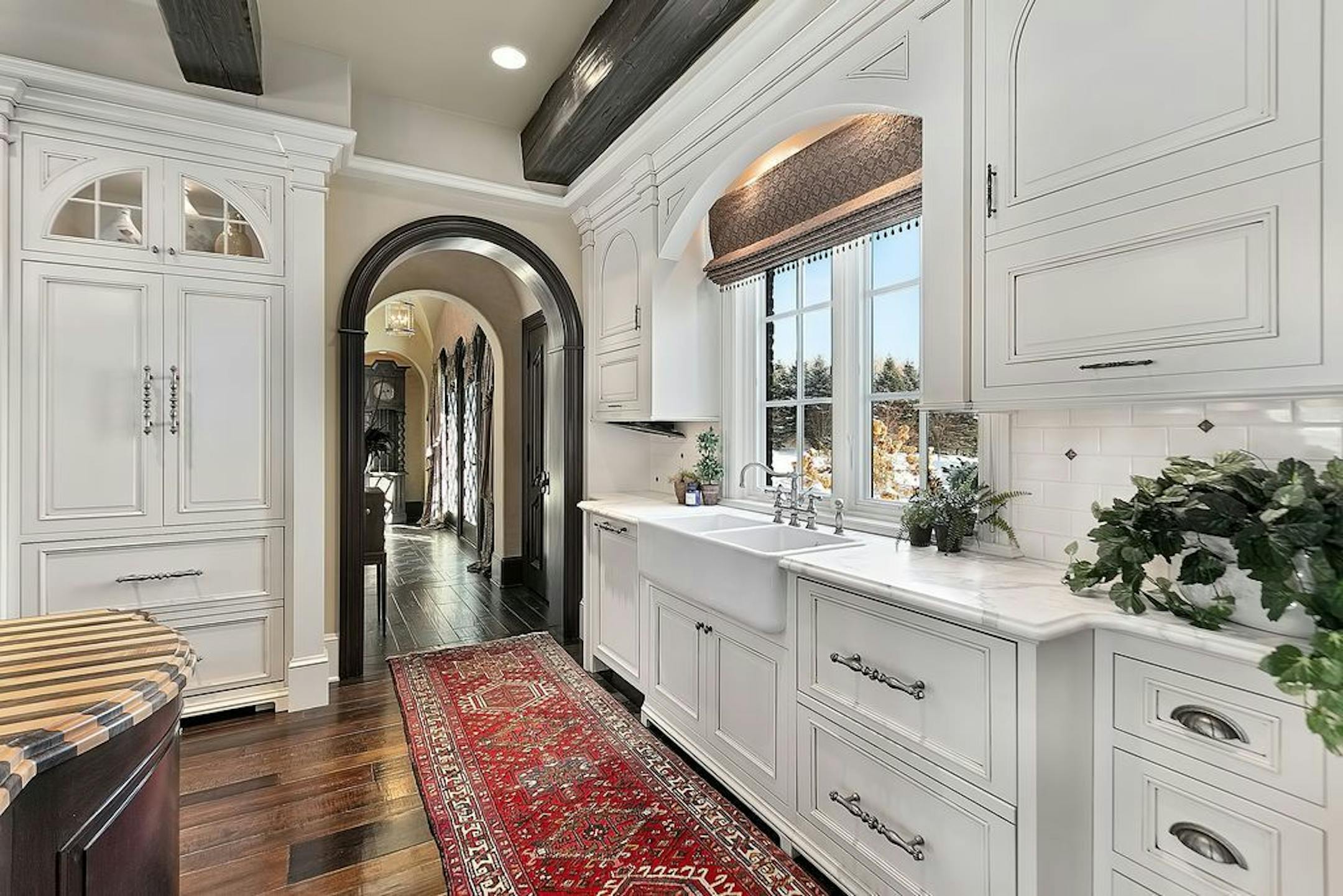 The kitchen has marble countertops and top-of-the-line appliances.