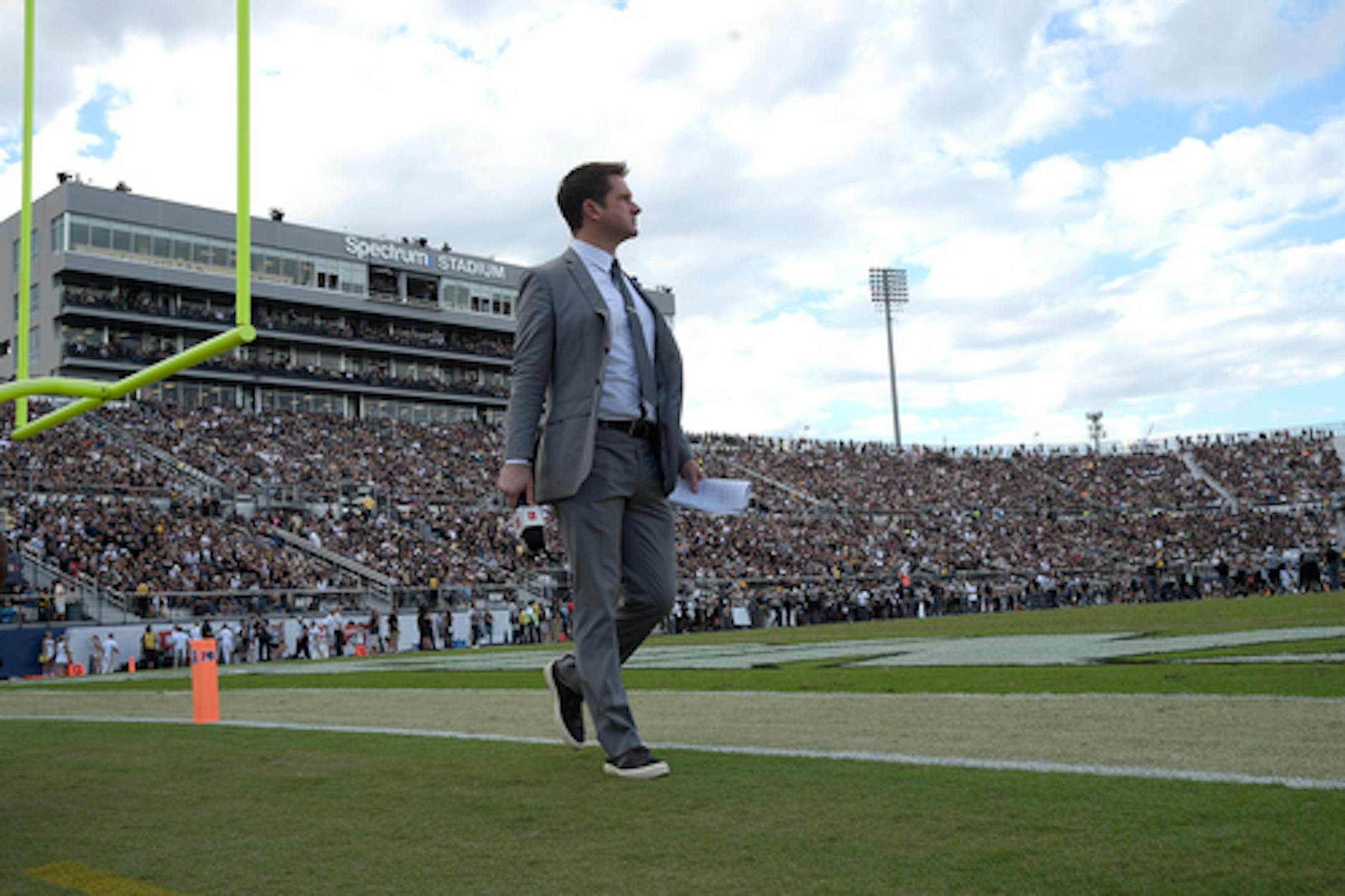 ESPN television football analyst Todd McShay works from the field during the second half of the American Athletic Conference championship NCAA college football game between Central Florida and Memphis Saturday, Dec. 2, 2017, in Orlando, Fla. Central Florida won 62-55. (Phelan M. Ebenhack via AP) ORG XMIT: NYWWP
