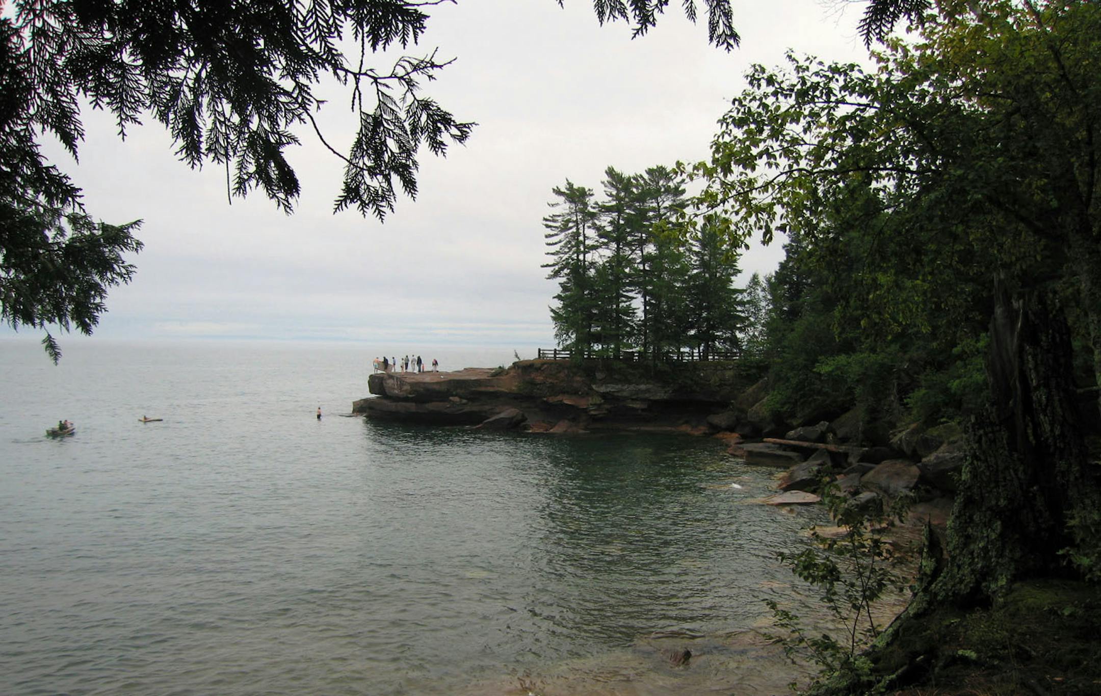 Family frolicks on rocks at Big Bay State Park on Madeline Island, Wisc.