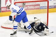 Minnetonka's Hagen Burrows (19) and Chanhassen's Kam Hendrickson tangle during the section final. On Sunday,  Burrows and Hendrickson were honored as 