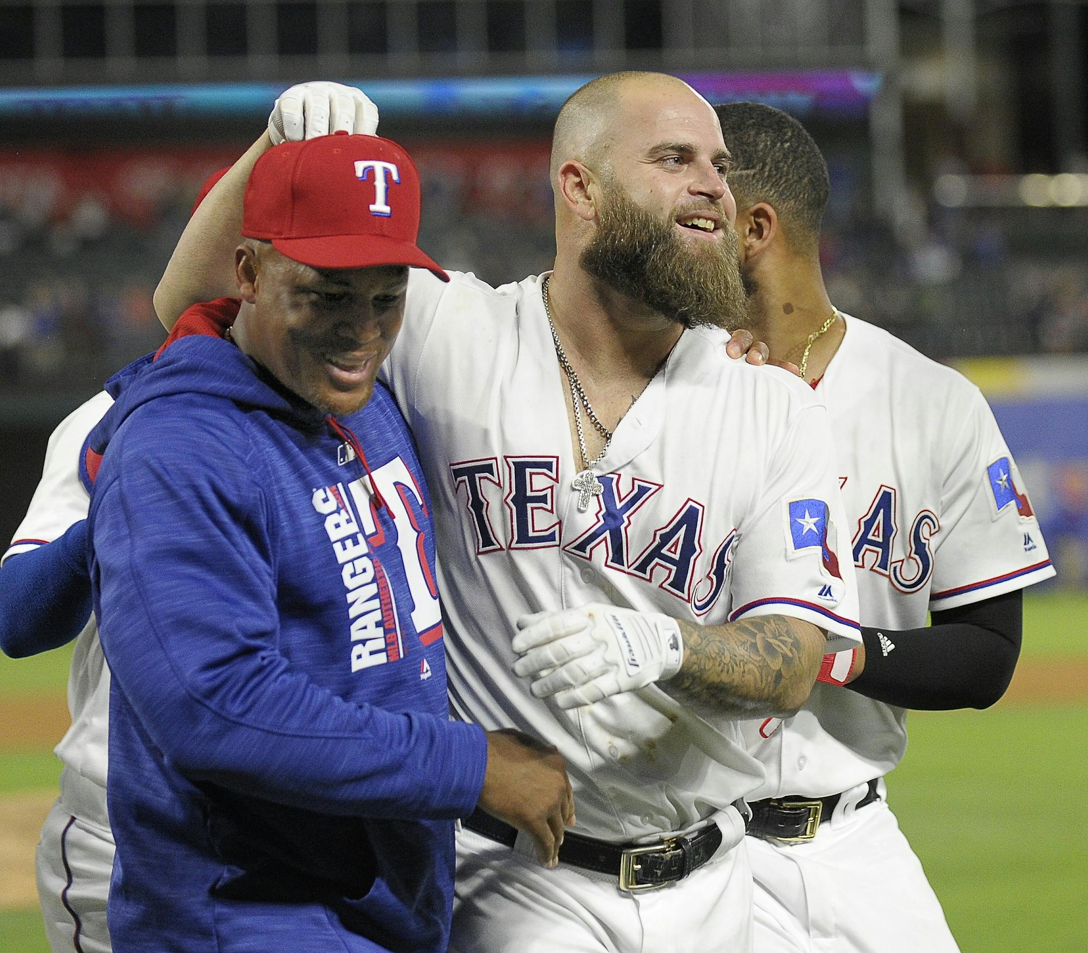Texas Rangers third baseman Adrian Beltre, left, celebrates with designated hitter Mike Napoli, who hit a walk-off home run against the San Diego Padres at Globe Life Park in Arlington, Texas, on Thursday, May 11, 2017. The Rangers won, 5-2. (Max Faulkner/Fort Worth Star-Telegram/TNS)
