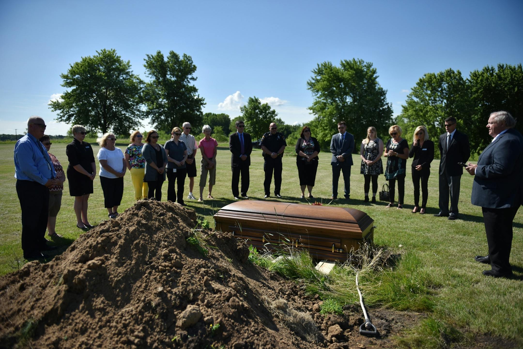 Pastor Gordon Gathright (right) led attendees in prayer.