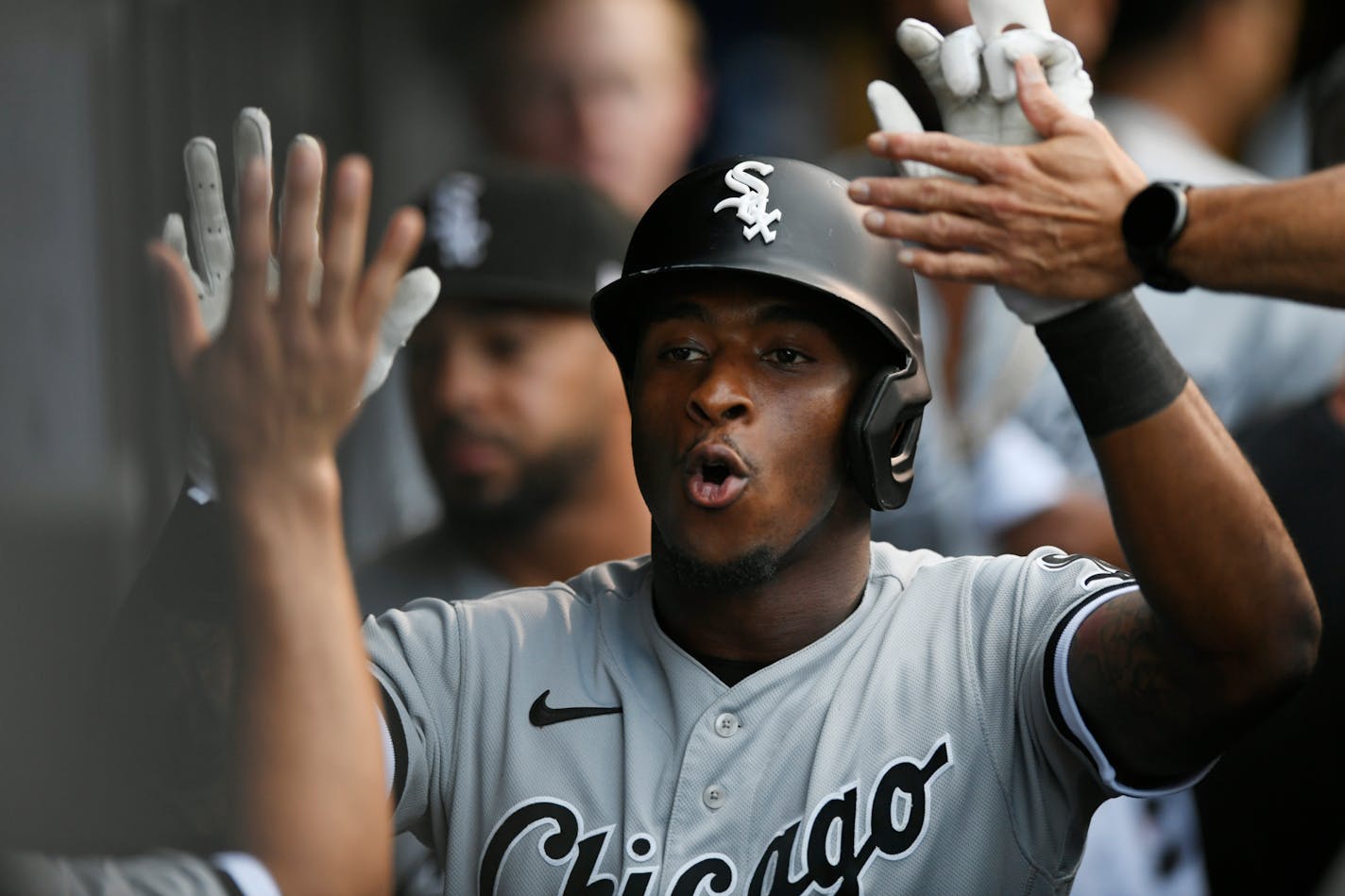 Chicago White Sox's Tim Anderson celebrates with teammates in the dugout after hitting a solo home run during the first inning of a baseball game against the Chicago Cubs Sunday, Aug 8, 2021, at Wrigley Field in Chicago. (AP Photo/Paul Beaty)