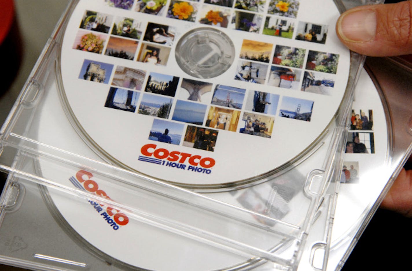 Ashley Lanigan used a system manufactured by Rimage Corp to turn customer's photographs into an image CD at the St. Louis Park Costco. In addition to the images being burned to the CD, they may also be burned to a DVD or Blu-Ray disc. They are also printed as thumbnails on the cover using thermal imaging.