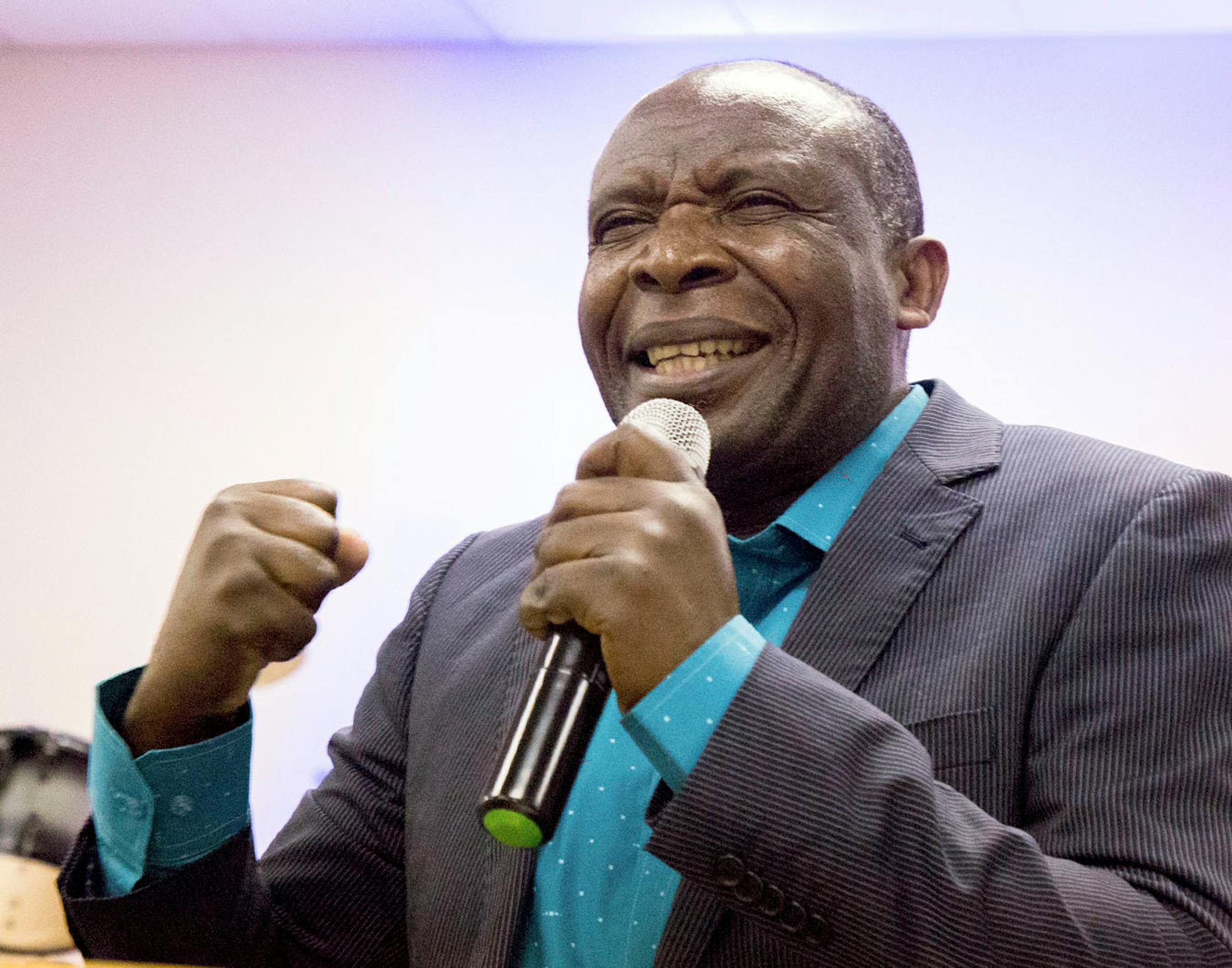 Ladislas Mihigo preaches during the church service for African refugees, at Bethel Christian Fellowship Church.