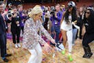 LSU coach Kim Mulkey and star Angel Reese (10) celebrated after winning an NCAA Elite Eight game last year. (Tribune News Service)