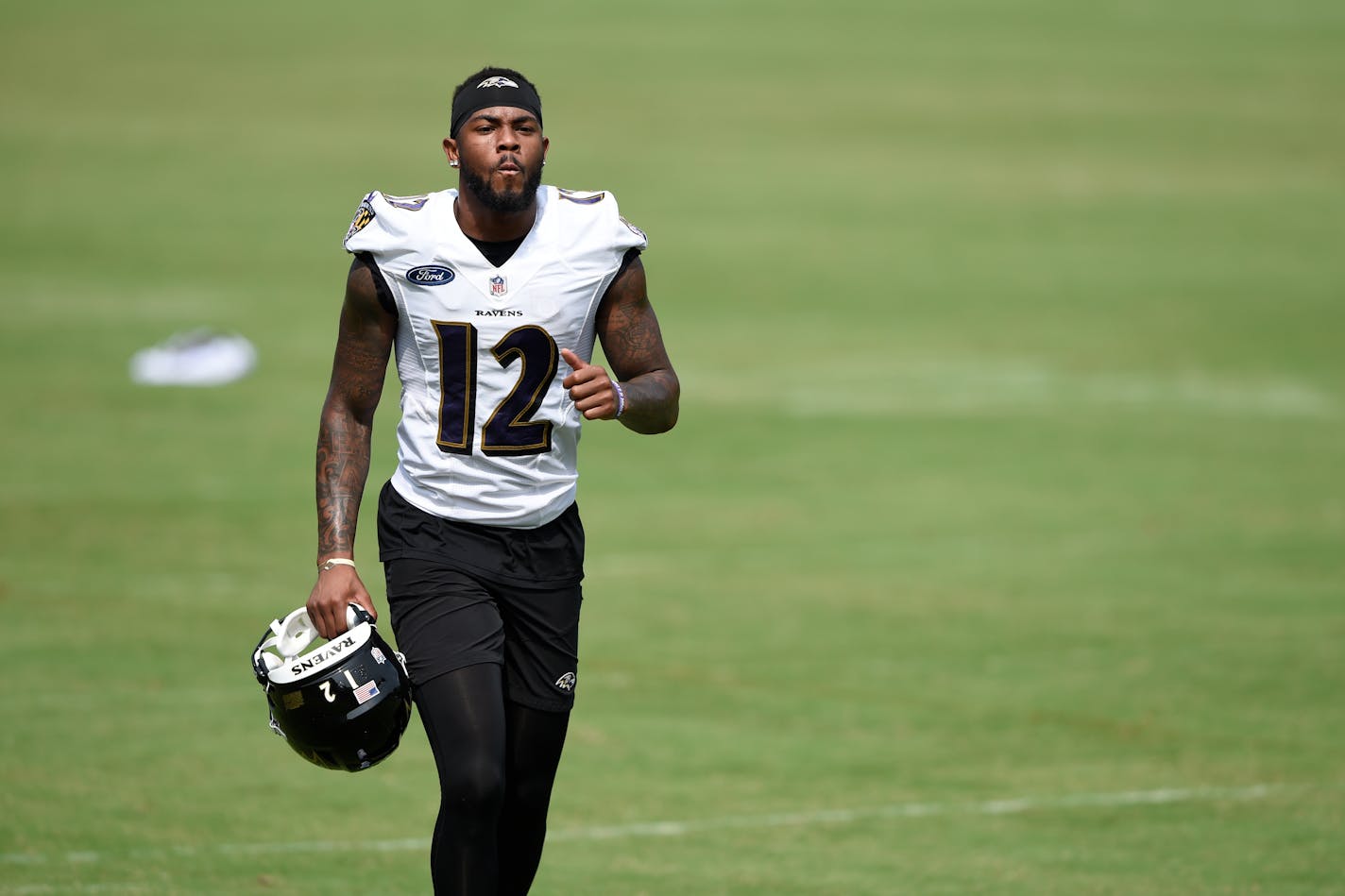 Baltimore Ravens Rashod Bateman runs off the field after an NFL football practice, Monday, Aug. 9, 2021 in Owings Mills, Md.(AP Photo/Gail Burton)