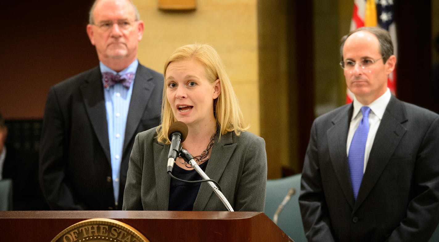 Sept. 6, 2013: MNsure director April Todd-Malmlov talks about MNsure. On the left is health commissioner Dr. Ed. Ehlinger; on the right is commerce commissioner Mike Rothman.