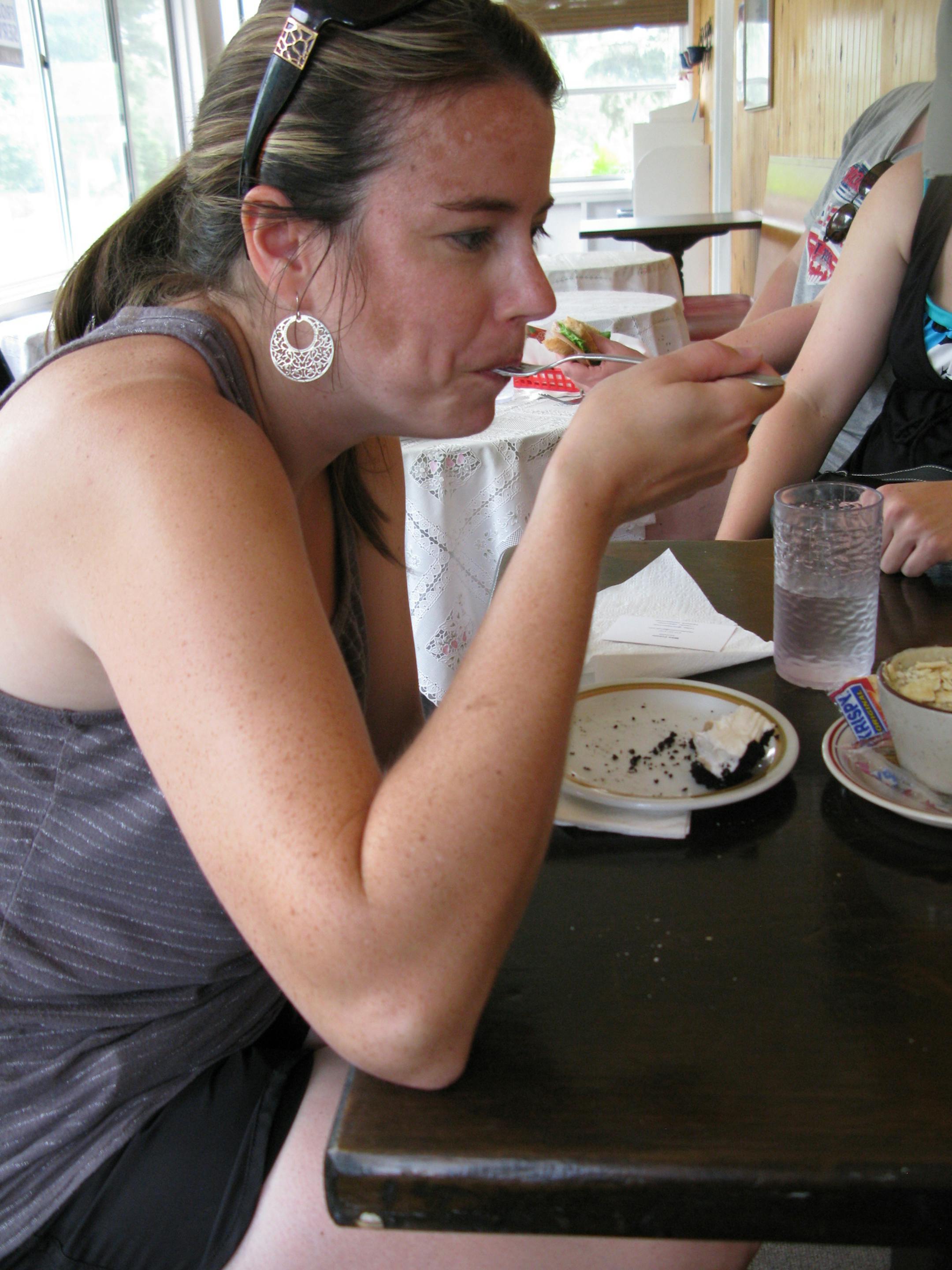 Becky Talle, 34, a kindergarten teacher from Eagle Lake, Minnesota, eats a piece of pie at the Aroma Pie Shop -- just yards from the Root River Trail where she was cycling with friends.