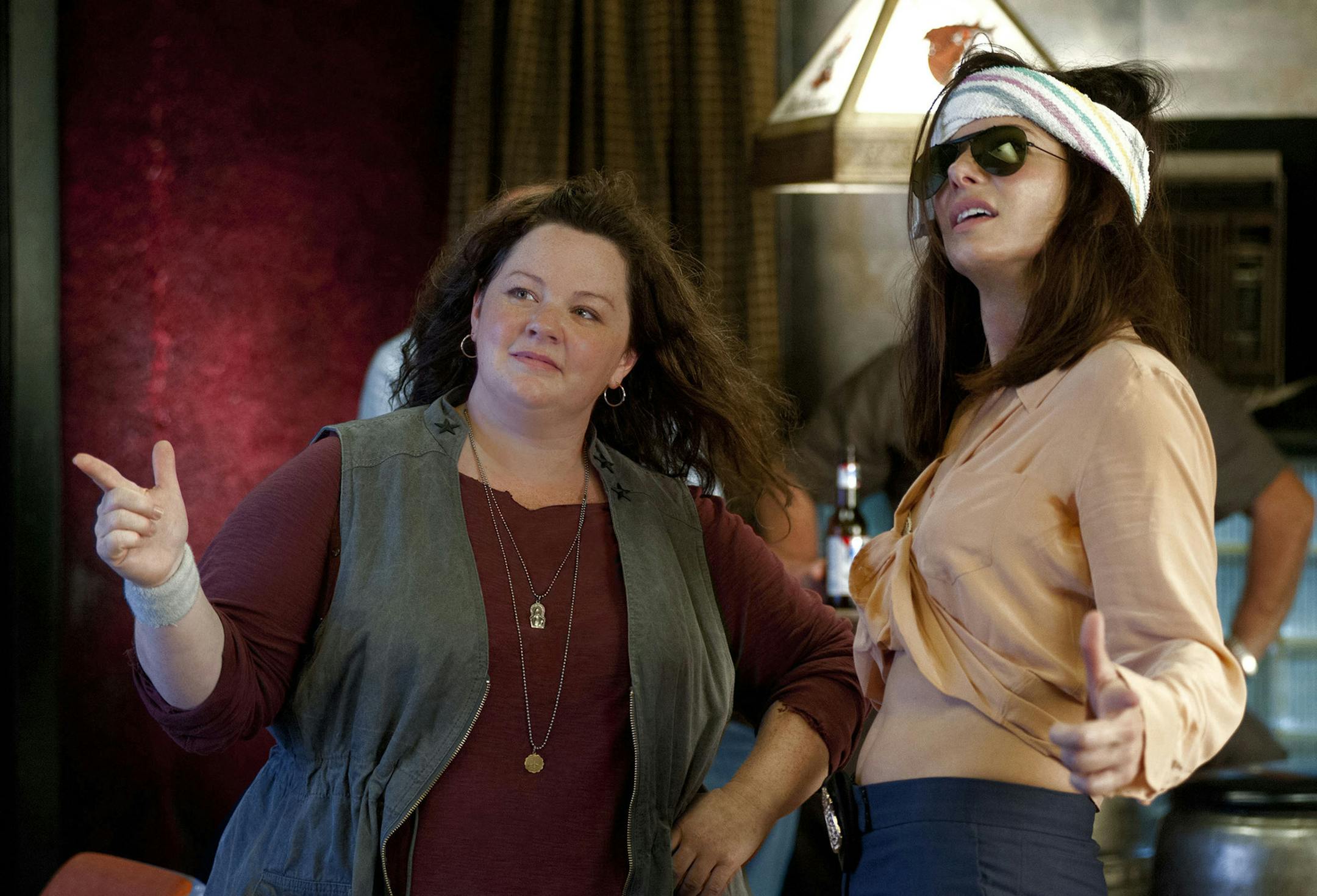 This film publicity image released by 20th Century Fox shows Sandra Bullock as FBI Special Agent Sarah Ashburn, right, and Melissa McCarthy as Boston Detective Shannon Mullins in a scene from "The Heat." (AP Photo/20th Century Fox, Gemma La Mana) ORG XMIT: MIN2013062613464185