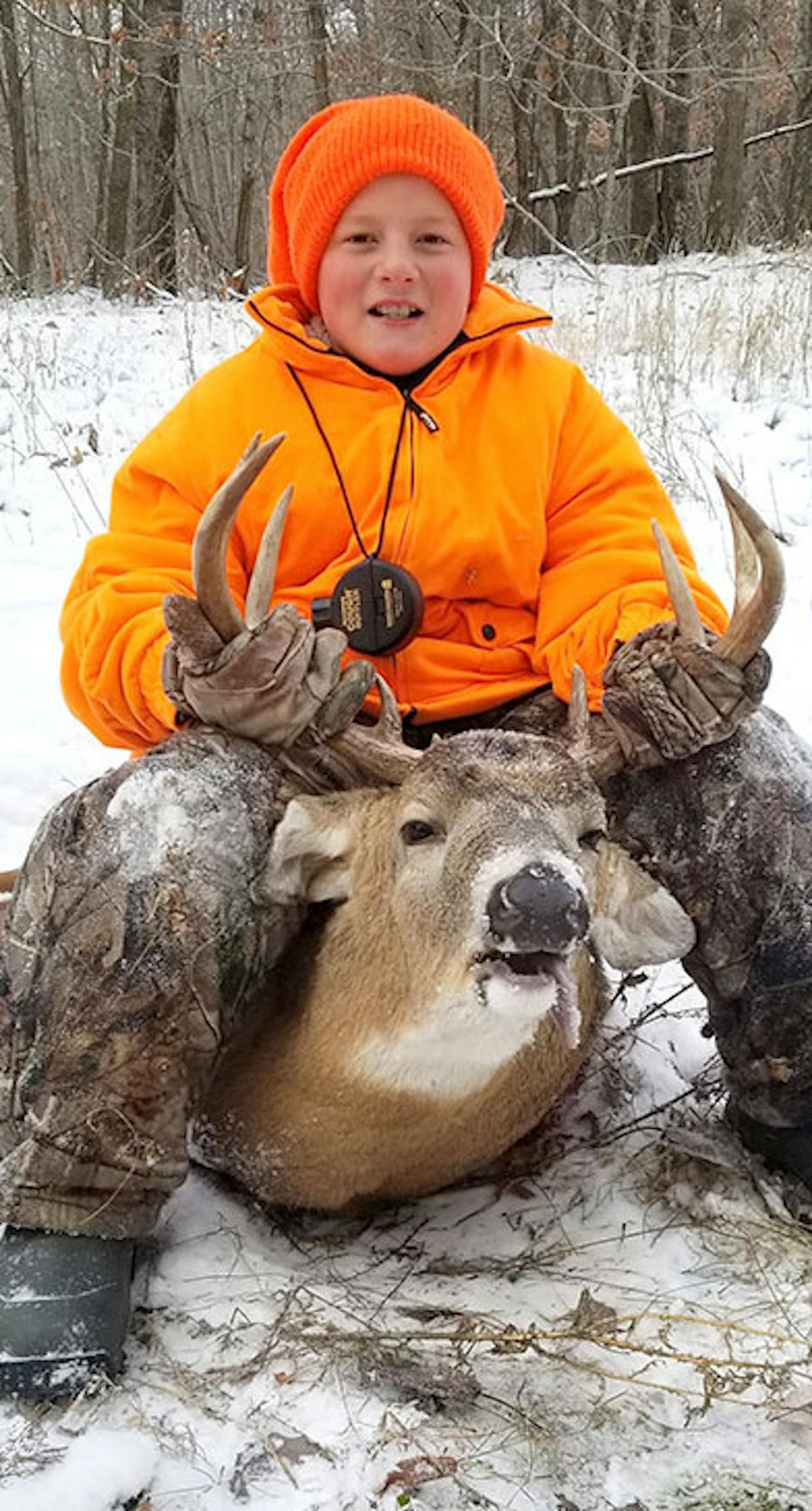 John George, 11, of the Detroit Lakes area, was accompanied by his father, Simon George, when the youth shot this 8-pointer last Friday near Frazee.