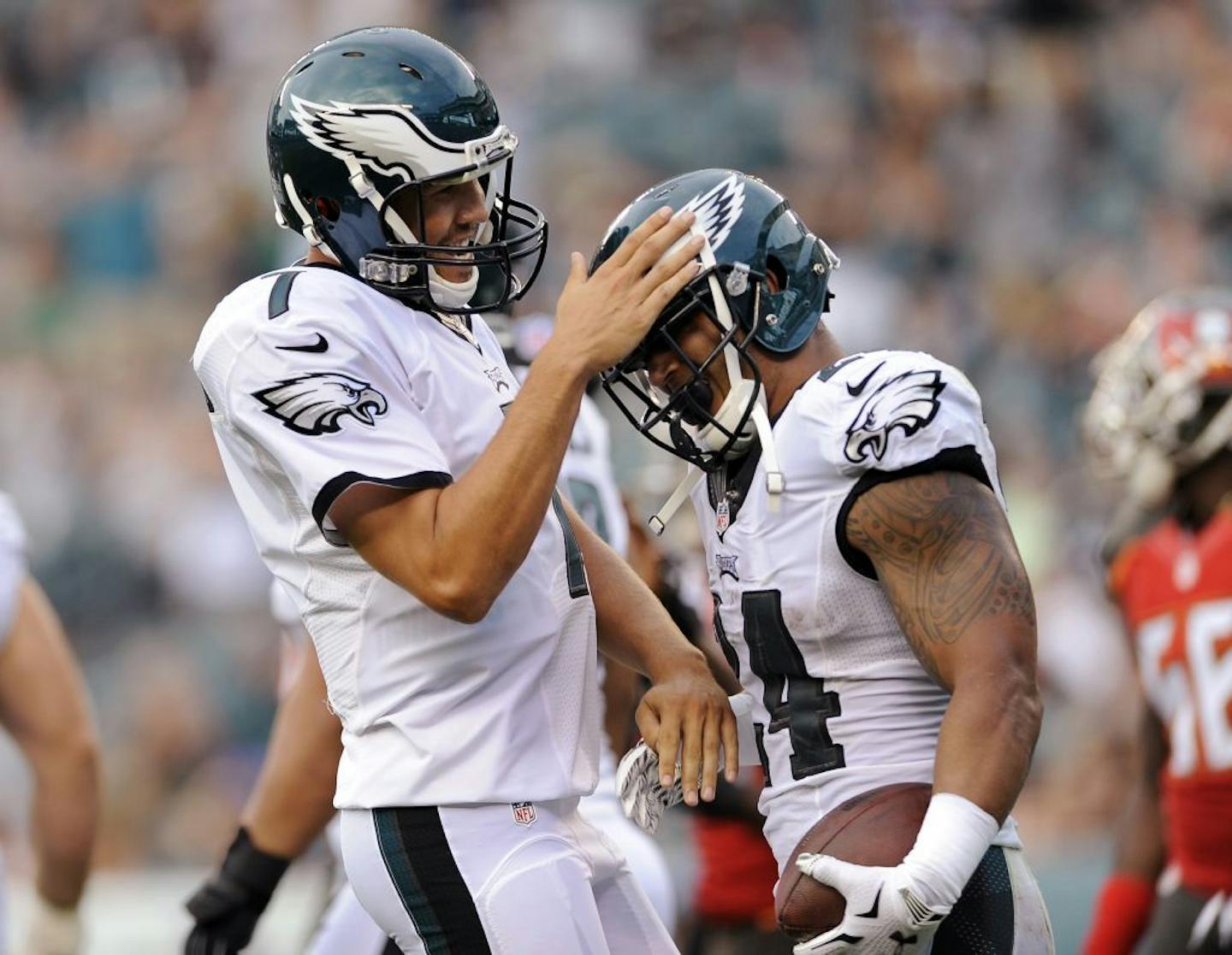 Philadelphia Eagles quarterback Sam Bradford, left, congratulates Eagles running back Ryan Mathews (24) after scoring a touchdown during the first half of a preseason NFL football game against the Tampa Bay Buccaneers on Thursday, Aug. 11, 2016, in Philadelphia.