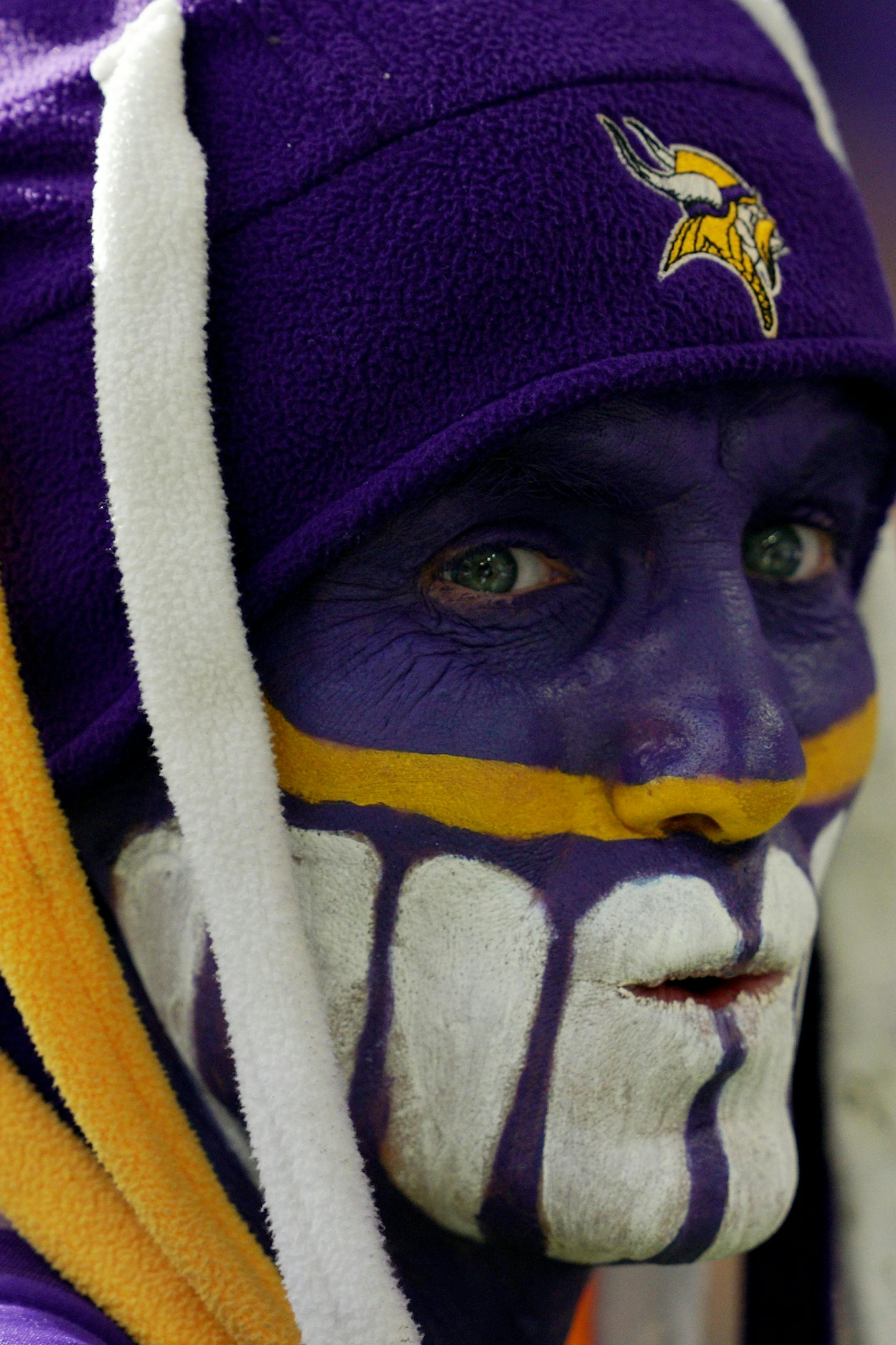 Eric Streich, of Madison, Minn. wandered the sidelines dressed head to toe in purple and gold ahead of Sunday night's game agains the Seattle Seahawks.