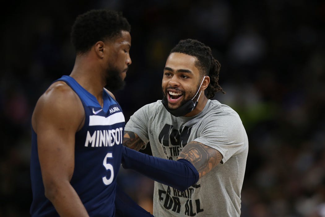 Timberwolves guard D’Angelo Russell, right, reacted after Malik Beasley (5) made one of his five three-point baskets during the second half against the Golden State Warriors at Target Center on Sunday.