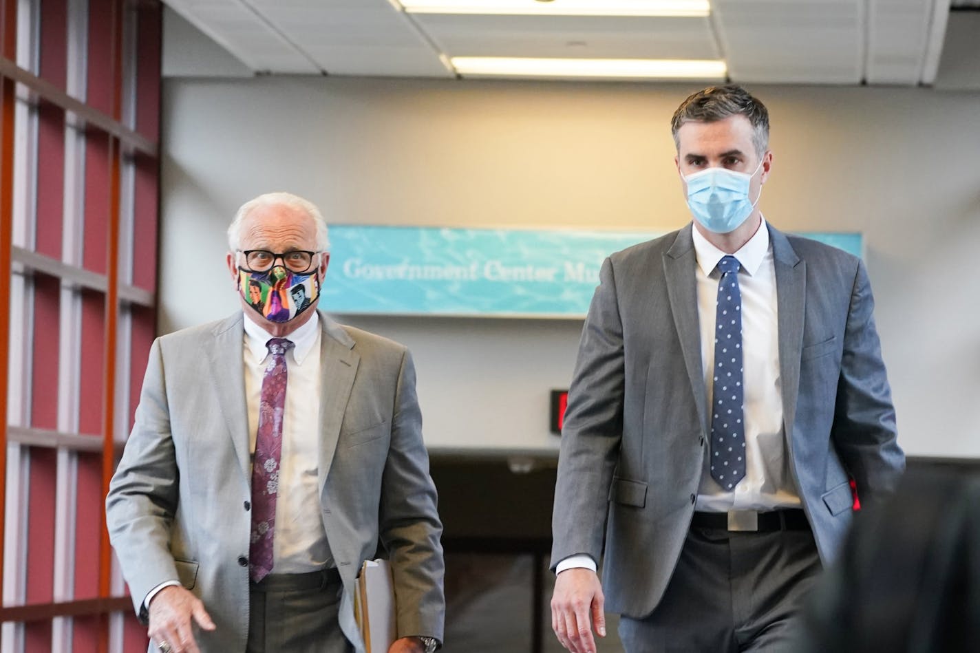 Former Minneapolis police officer Thomas Lane, right, entered the Hennepin County Public Safety Facility on June 29 with his attorney Earl Gray, left.