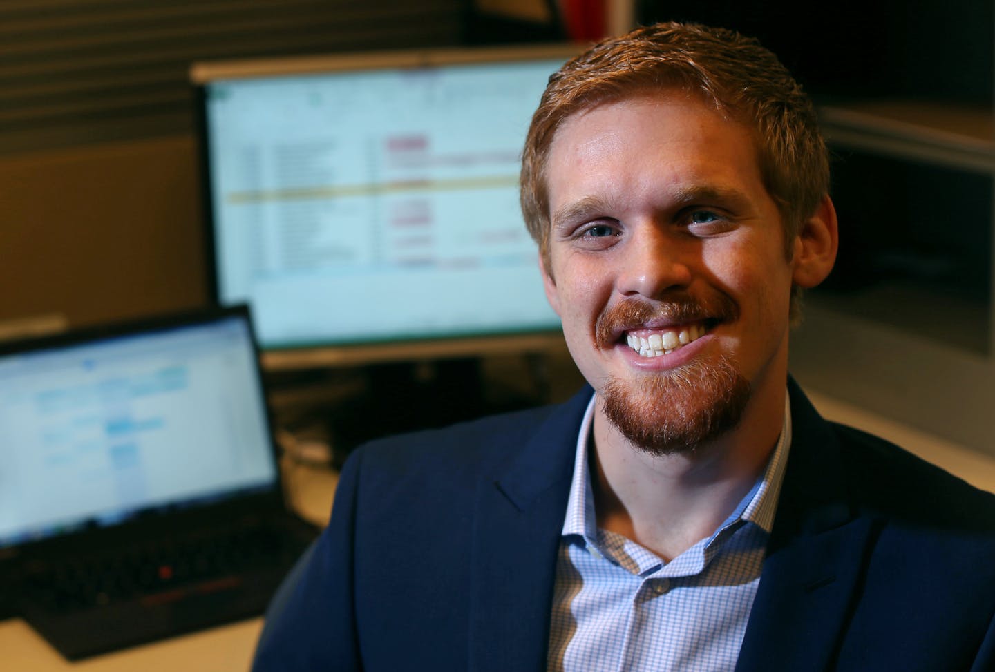 A portrait of Scott Papez at his desk , he is a recent hire at PwC Wednesday January 13, 2016 in Minneapolis, MN. ] With college debt a much more pressing concern for younger workers than 401(k) retirement plans, a growing number of private companies are offering to help pay down student debt as a way to attract and retain millennials. PwC is one of the bigger firms, which gives employees $1,200 a year for up to six years to help pay off student loans Jerry Holt/Jerry.Holt@Startribune.com