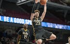 DeLaSalle's Jamison Battle dunked the ball during the second period of their matchup with Bemidji of the boys' basketball state tournament quarterfina