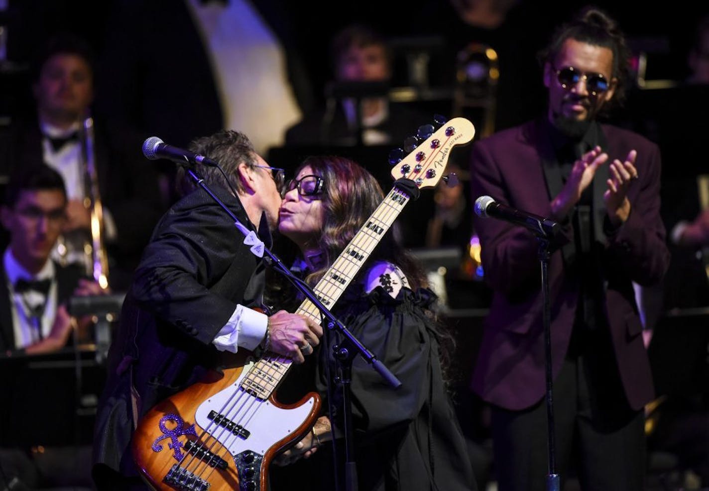 Tyka Nelson, Prince's sister, kisses Paul Peterson, a bassist who used to perform with Prince, after they sang "Purple Rain" after the late rock star Prince was awarded an honorary degree by the University of Minnesota at the Ted Mann Concert Hall Wednesday, Sept 26, 2018, in Minneapolis. University President Eric Kaler and Regent Darrin Rosha presented the school's highest honor, the Doctorate of Humane Letters, to Prince's sister, Nelson, in a ceremony on campus.