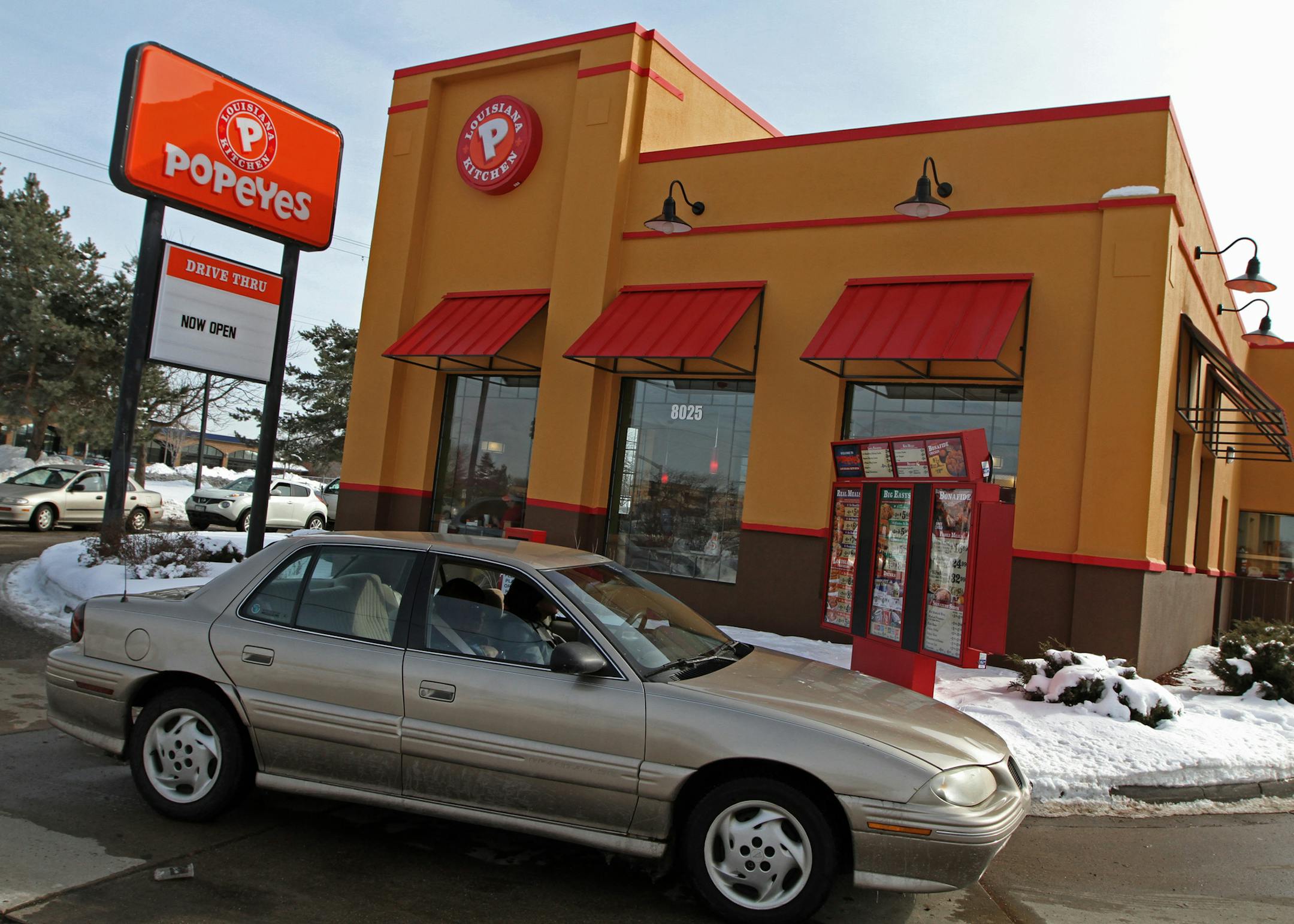 The first of 13 new Popeyes opened this week in Brooklyn Park, as people lined up both inside and outside in cars to place their orders. Popeyes has been a minor fast food player in the Twin Cities with just one lone Minneapolis store. But the company bought 13 KFCs from a bankrupt KFC franchisee last fall, giving it a much bigger presence versus its arch-chicken rival. Popeyes is in the process of converting the KFC's, with more to come in stages through spring and summer.] Bruce Bisping/Star T