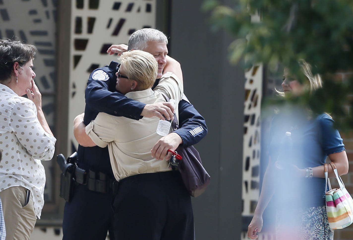 Mendota Heights Police chief Mike Aschenbrener was given a hug outside of the church during visitation for slain Mendota Heights police officer Scott Patrick at St. Stephen's Lutheran Church Tuesday August 5 , 2014 in West St. Paul , MN . .] Jerry Holt Jerry.holt@startribune.com