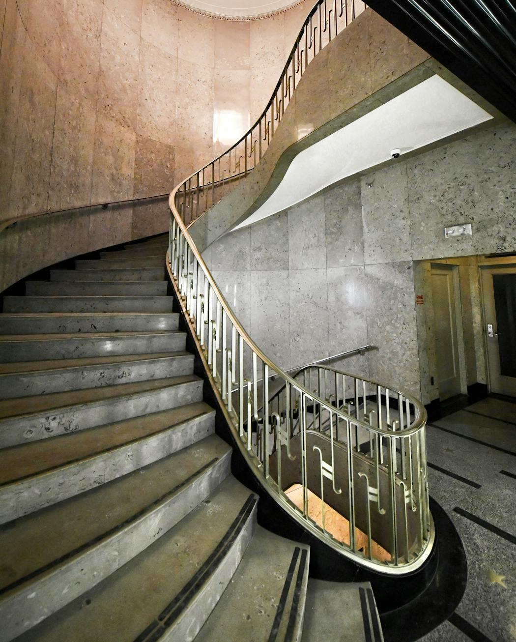 The well-worn, curved lobby staircase of the Rand Tower in downtown Minneapolis. The building was completed in 1929.