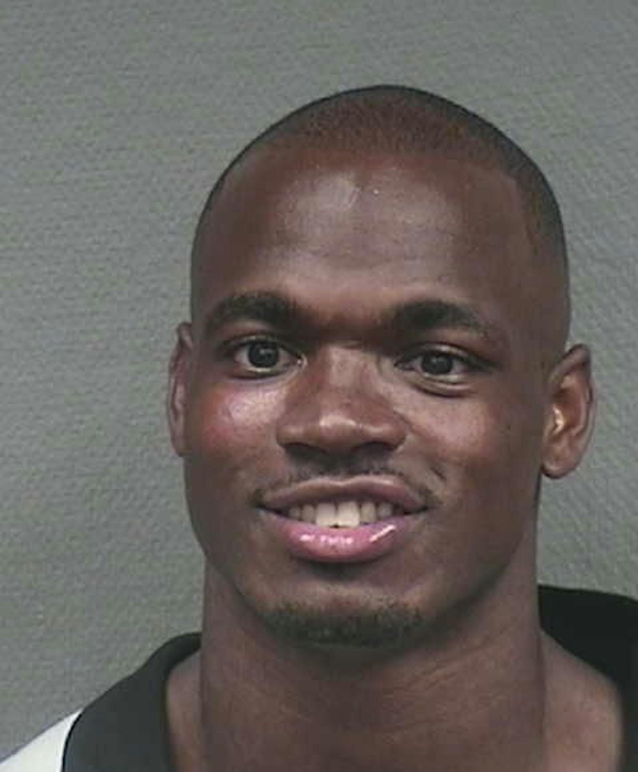 Adrian Peterson's mug shot, from his arrest early Saturday in Houston, where he is charged with resisting arrest.