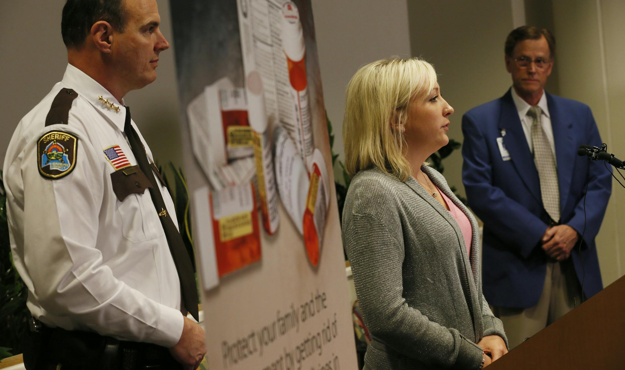 Amanda (center), flanked by Hennepin County Sheriff Rich Stanek left and and North Memorial E.R. Dr. Dave Roberts spoke about her addiction to pain killers, and her uses of heroin during a press conference at North Memorial Hospital. Hennepin County has been hit by a dramatic increase in heroin overdose deaths and emergency room admissions for overdoses, officials announced Thursday at a joint news conference of the Sheriff&#x201a;&#xc4;&#xf4;s Office and North Memorial Medical Center in Robbins