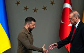 FILE - Turkey's President Recep Tayyip Erdogan, right, shakes hands with Ukraine's President Volodymyr Zelenskyy after a joint news conference followi