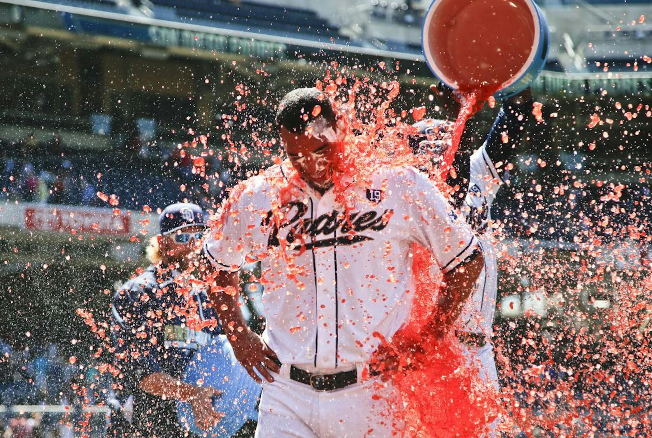 San Diego Padres starting pitcher Tyson Ross is doused by teammates after pitching a complete baseball game 3-0 shutout over the Cincinnati Reds, Wednesday, July 2, 2014, in San Diego.