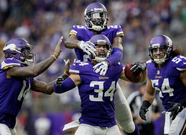 Andrew Sendejo celebrated with teammates after an interception against Tampa Bay. Aka "Mr. Fun," he will make his 32nd start for the Vikings on Sunday