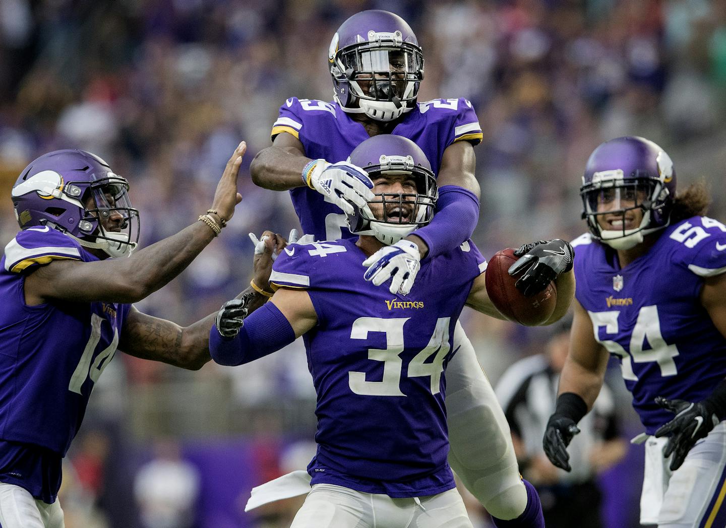 Andrew Sendejo celebrated with teammates after an interception against Tampa Bay. Aka "Mr. Fun," he will make his 32nd start for the Vikings on Sunday.