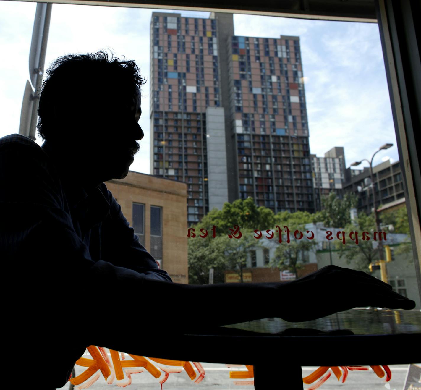 Jerry Holt &#x2022; Jgholt@startribune.com Minneapolis 07/26/10:Planning to spend a large part of the day trying to meet residents and gain access to the cedar riverside towers. ..... IN THIS PHOTO: ] Abdirizak Bihi talked about the Riverside Plaza in a near bye coffee shop.