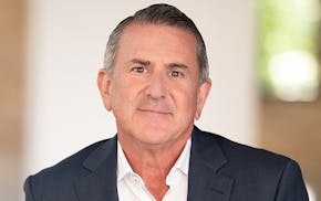 Brian Cornell's realized pay went down despite improved earnings because the value of previously issued long-term equity awards declined.