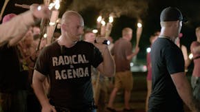 ADDS ID: In this Friday, Aug. 11, 2017, image made from a video provided by Vice News Tonight, Christopher Cantwell attends a white nationalist rally 