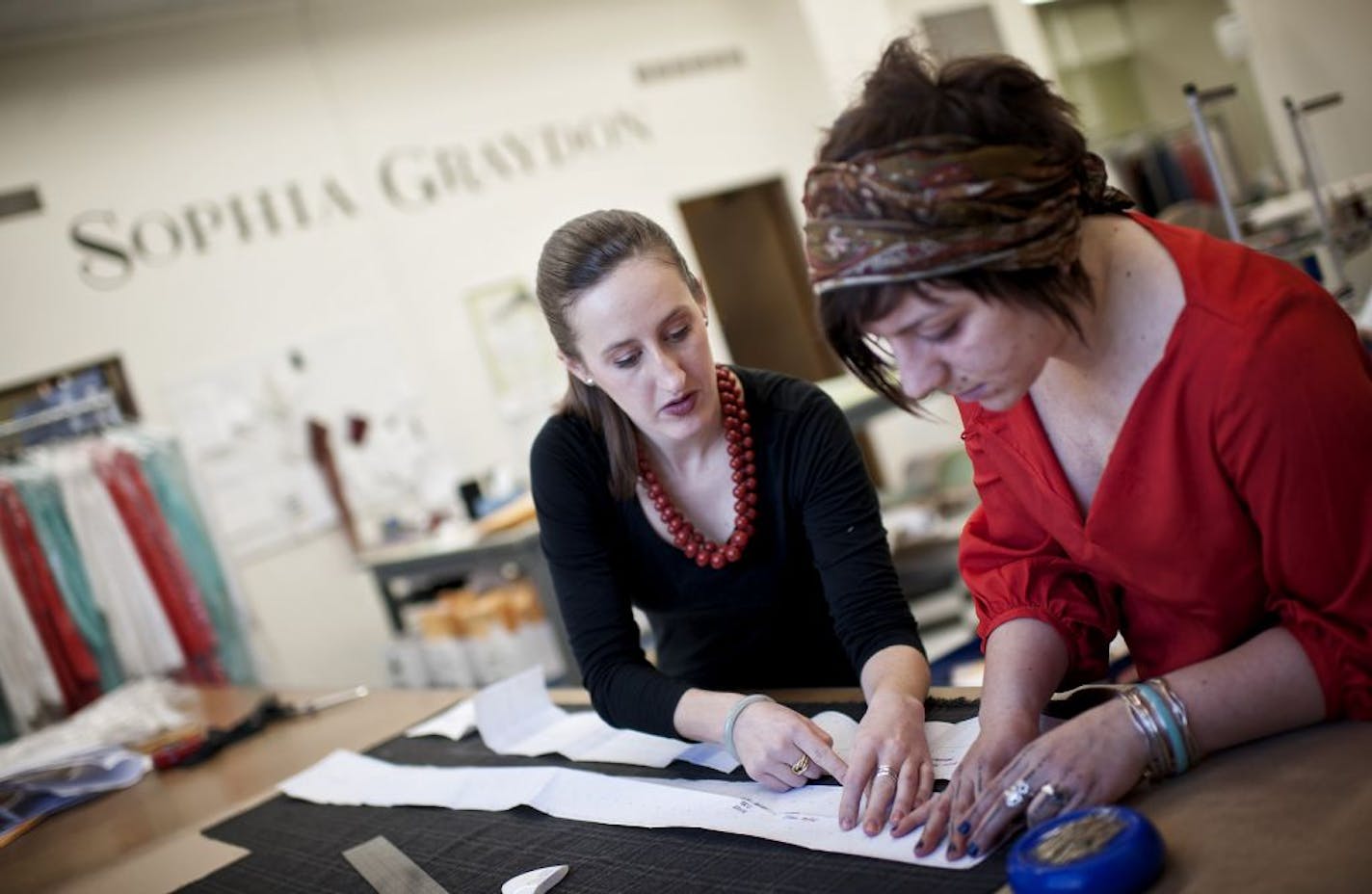 Ida Matthys, director of the atelier for Sophia Graydon, worked with Erin Hennes, right, on a pattern Monday in northeast Minneapolis.