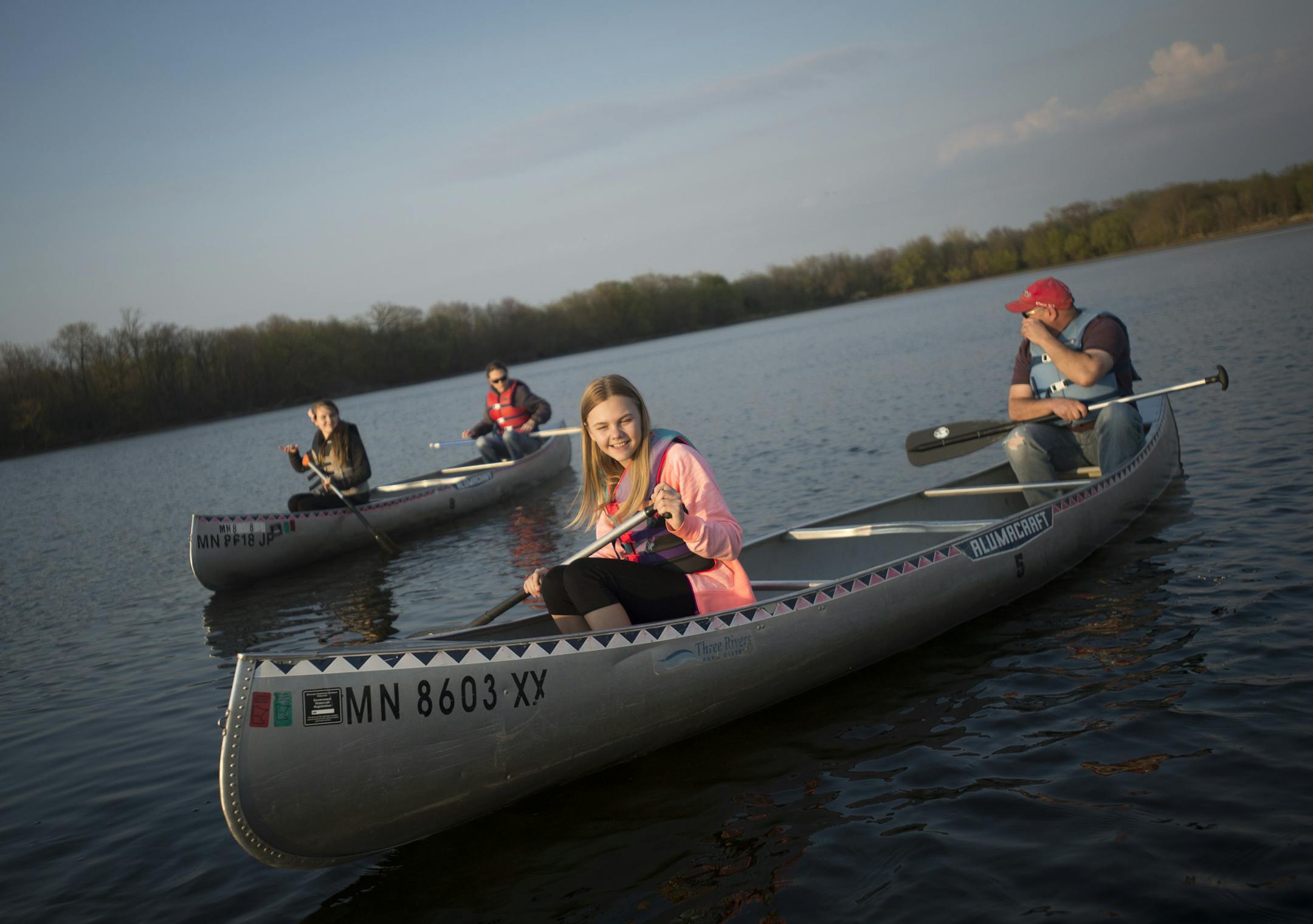 Jessica Krocak, 11, is all smiles as she paddles in a canoe with her father, Ryan Krocak, on Cleary Lake on Friday night. ] (Aaron Lavinsky | StarTribune) aaron.lavinsky@startribune.com Three Rivers Parks District has figured out the full moon is a time of celebration. They offer some kind of night excursion for every full moon. This spring and summer it's canoeing. We photographed an hour-long canoe trip on Friday, May 1, 2015 at Cleary Lake.