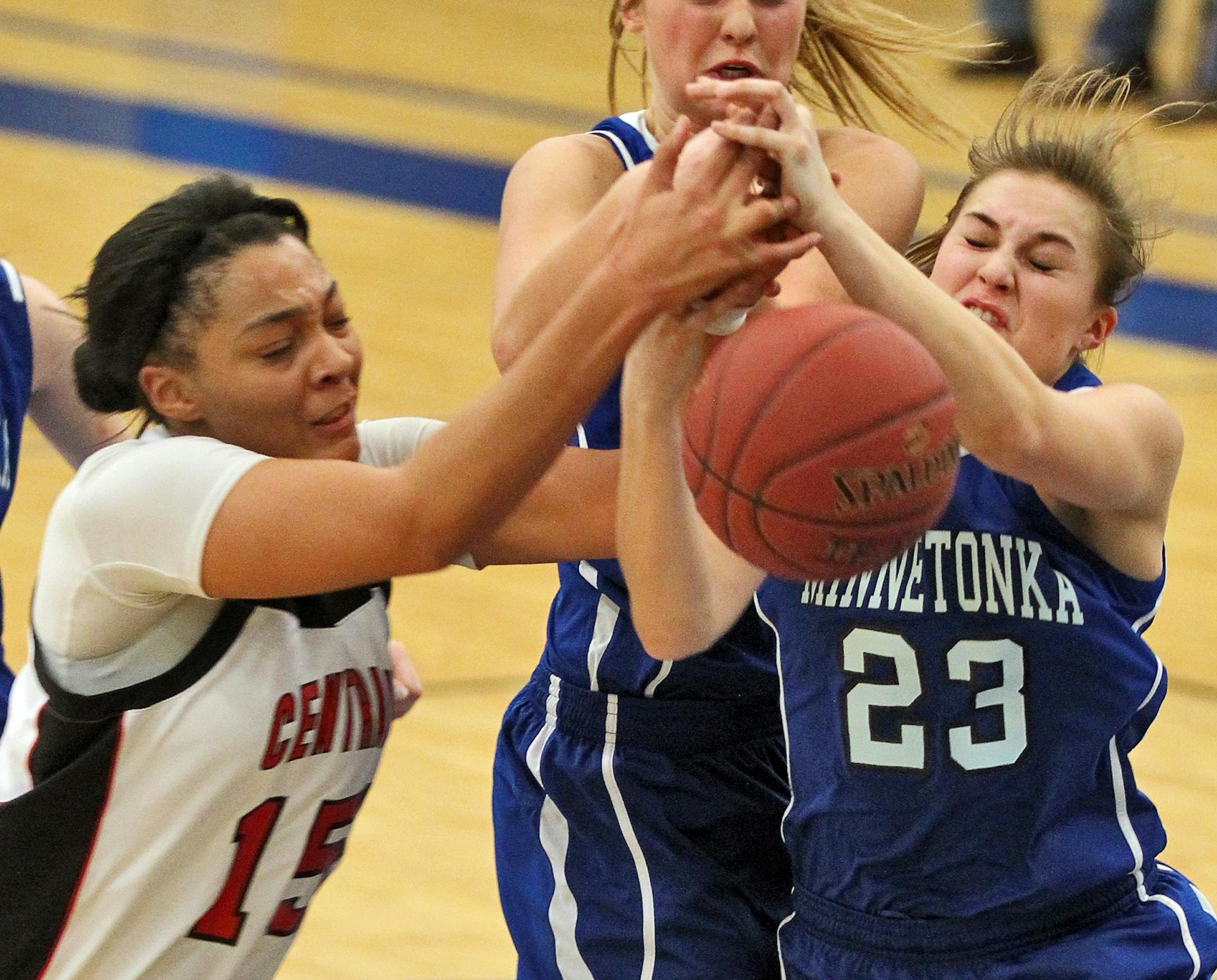 Holiday Girls Basketball Tournament. St. Paul Central vs. Minnetonka. St. paul Central's Rayna Sherow (15) and Minnetonka's Taylor Fredrickson (23) fought for control of a rebound. (MARLIN LEVISON/STARTRIBUNE(mlevison@startribune.com