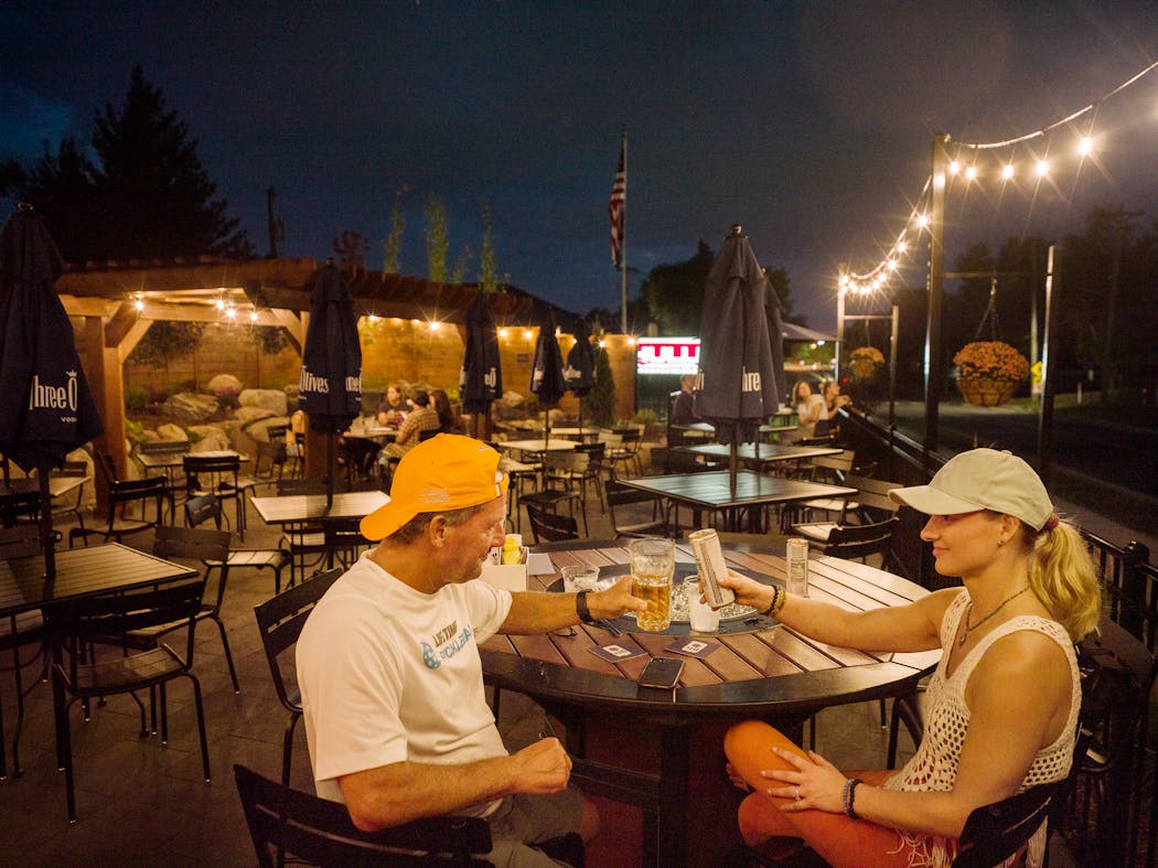 Jeff Ridley and his daughter Kalli Ridley took in the recently completed patio at Schullers Tavern in Golden Valley.