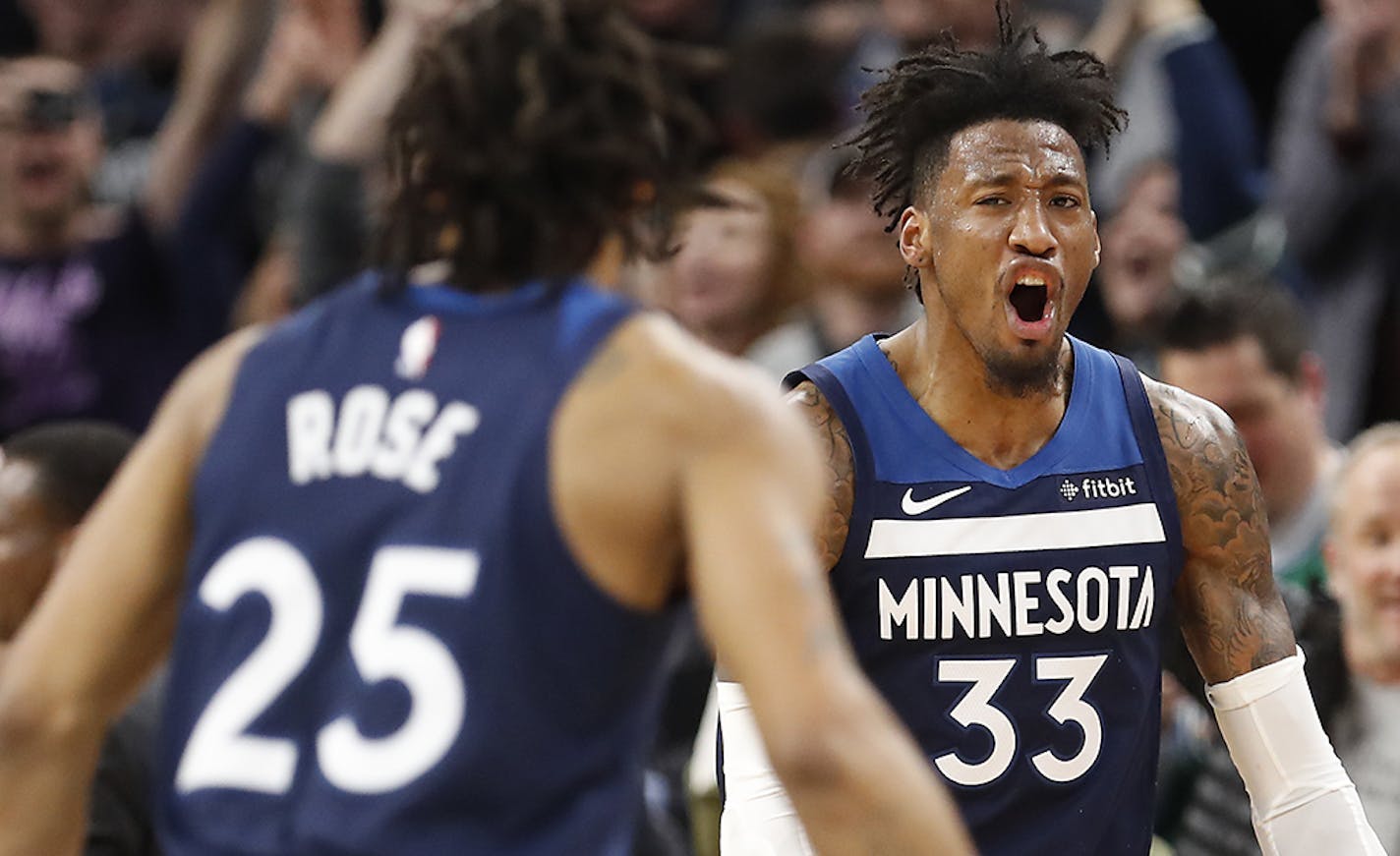 Minnesota Timberwolves forward Robert Covington (33) and Derrick Rose are done for the season.