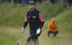 Steve Stricker of the US makes his way out of the rough on the 5th hole during the first round of the British Open Golf Championship, at Royal Birkdal