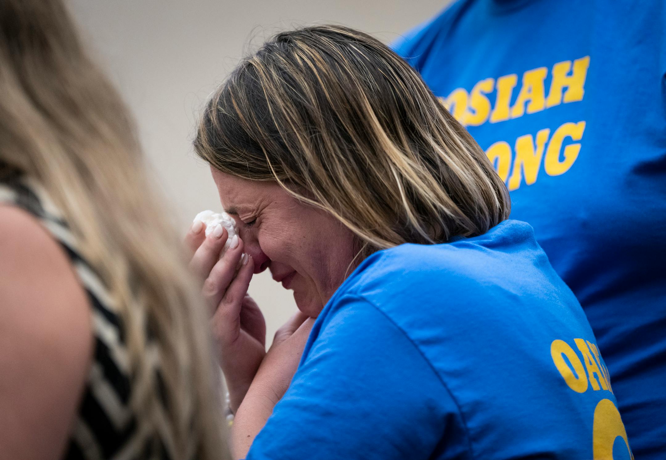Desiree Oakley, mother of Josiah Oakley, cries as a victim advocate reads her victim impact statement during sentencing for Sylvester Vaughn in Minneapolis.