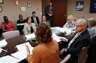 In this file photo from March, Gov. Tim Walz listened to Assistant Commissioner for Health Care and State Medicaid Director Marie Zimmerman during a r