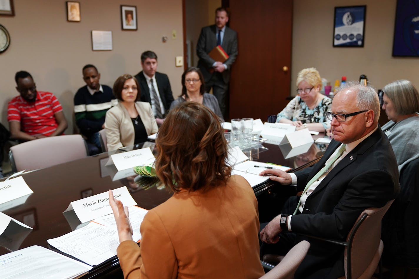 In this file photo from March, Gov. Tim Walz listened to Assistant Commissioner for Health Care and State Medicaid Director Marie Zimmerman during a round table discussion on health care at the Mid-Minnesota Legal Aid in St. Cloud.